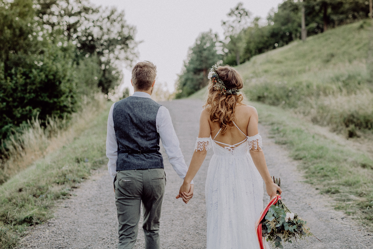 Bride and groom on rural road